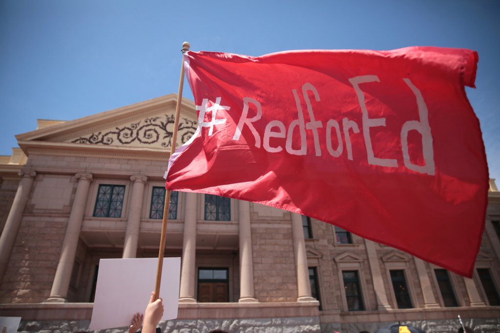 education protest flag in front of Arizona capitol