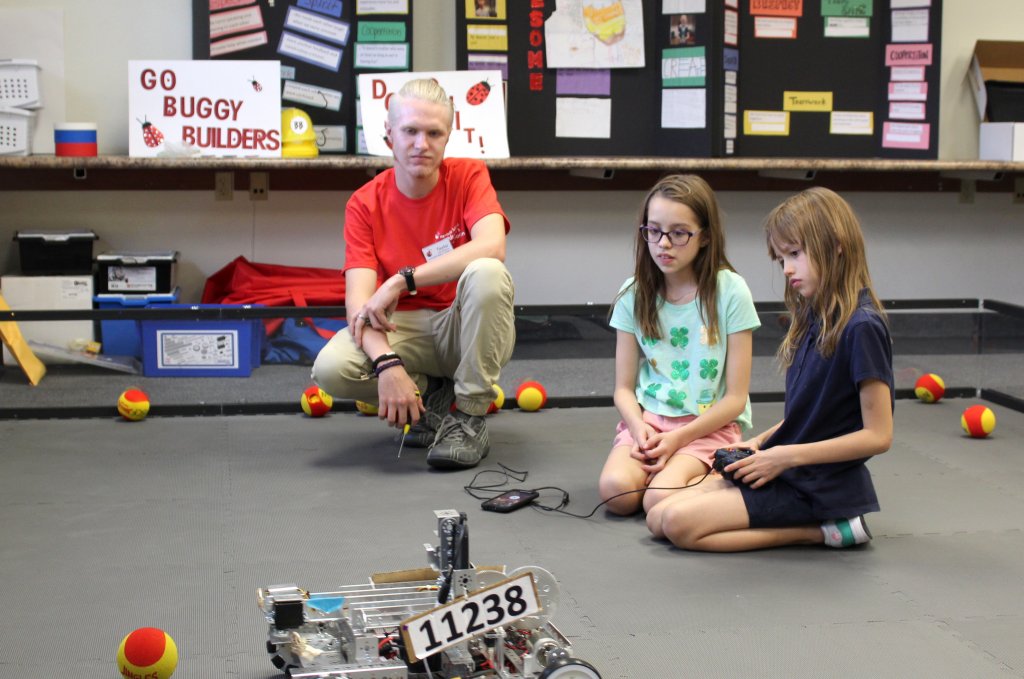 Visually impaired children play with a robot at the Nevada Blind Children's Foundation's new learning center.